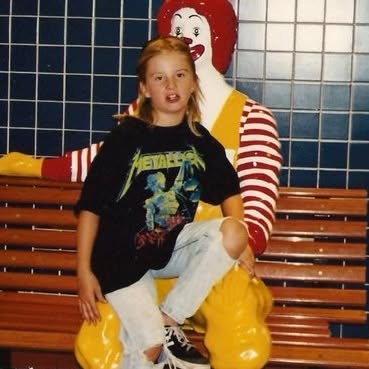 Young Brent in a Metallica t-shirt on the Ronald McDonald bench